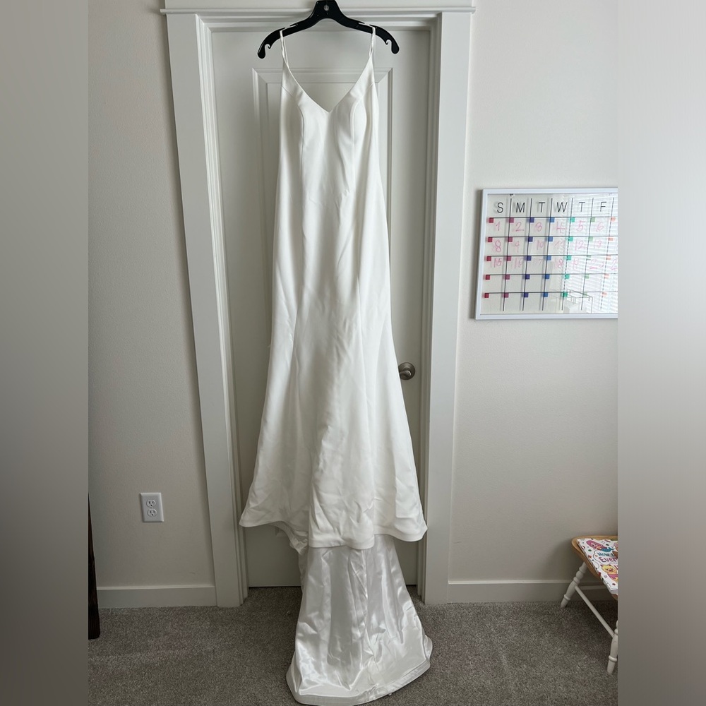Robert Bullock plunging V-neck beaded wedding gown